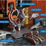 Fig. 1. Automated GTAW welding cell developed for feed forward control of welding parameters through in-process ultrasonic thickness measurement. A 6 DOF robotic manipulator is fitted with a welding head, laser profiler and weld camera. The PEAK LTPA ultrasonic driver and digitiser is located directly next to the location of welding.